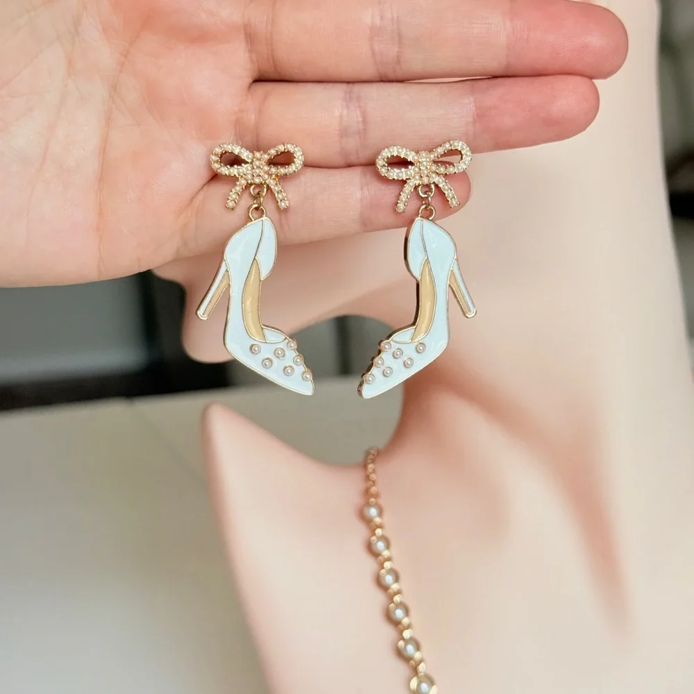 White Enamel High Heel Drop Earrings with Gold Bow